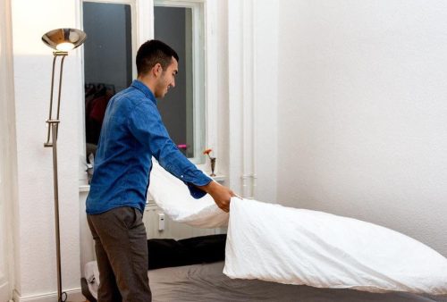 man making bed